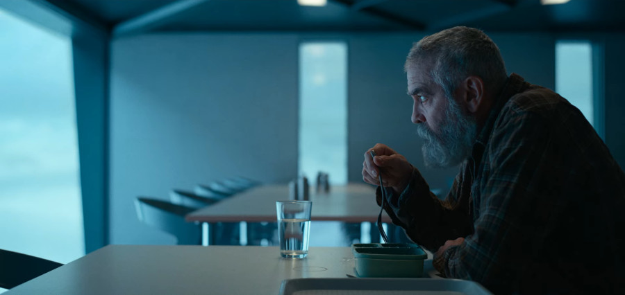 Dr. Augustine Lofthouse Clooney's character, Dr. Augustine Lofthouse, staring into the distance while having breakfast